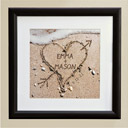 heart in sand framed print
